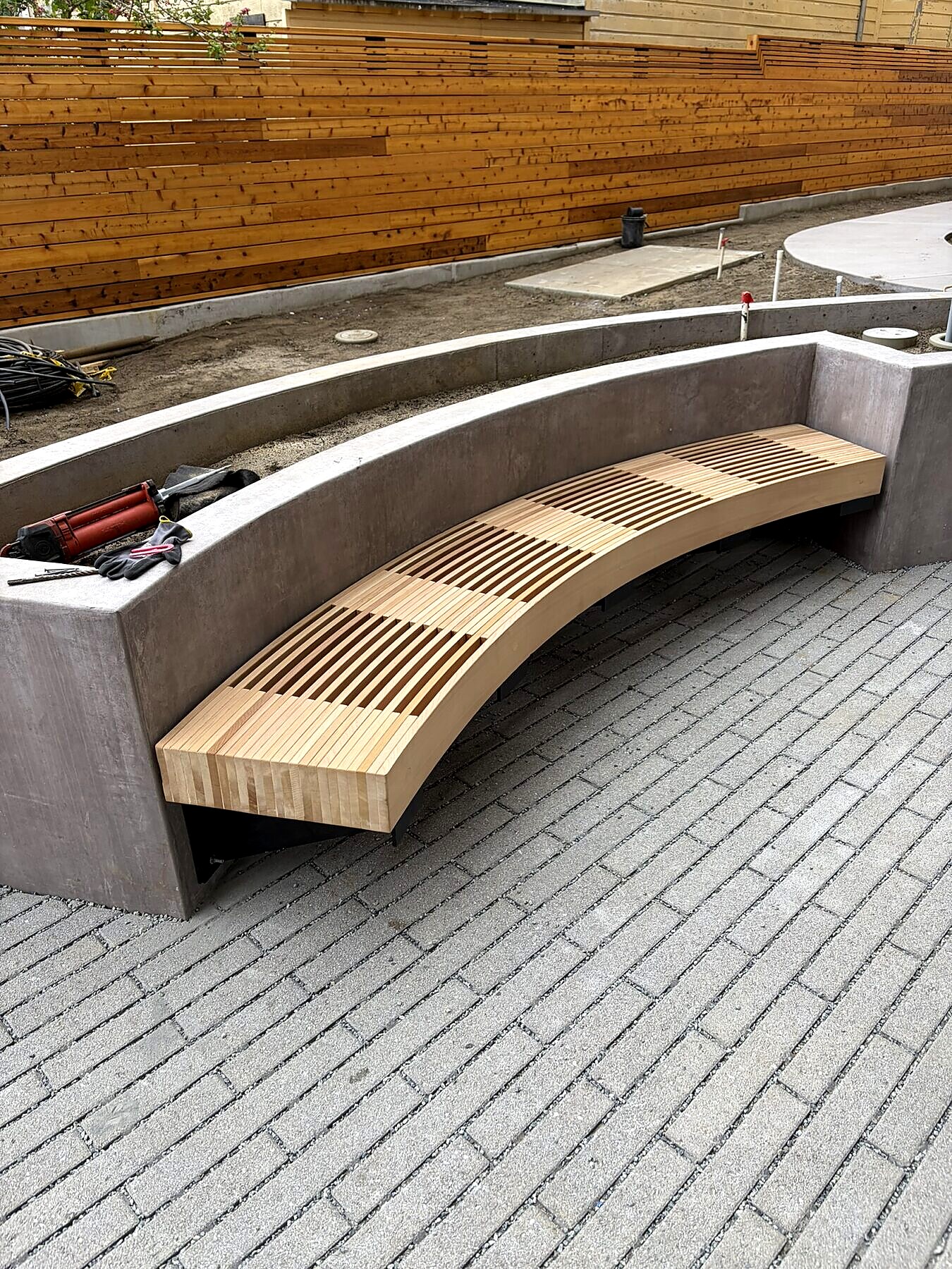 Curved wood bench, custom outdoor seating