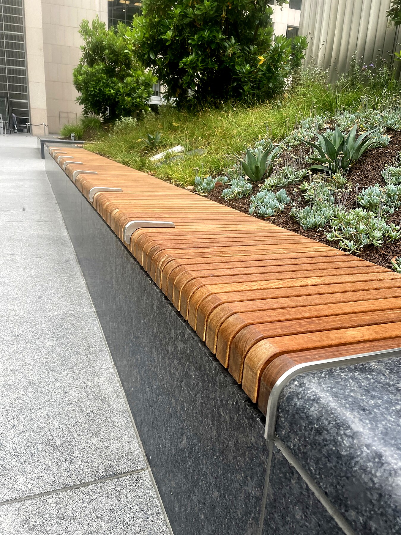 Ipe wood bench topper with stainless skate-stop clips