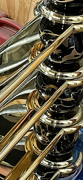 Polished brass guardrail with marbled black finish balusters