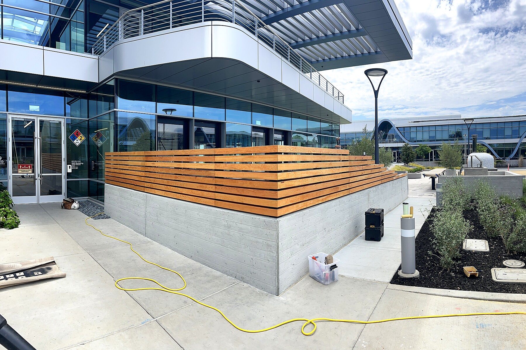 Horizontal wood slat privacy fence, corporate campus